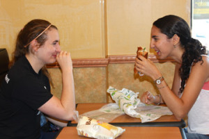 Seniors Emma Lehman and Olivia Chandrasekhar enjoy discounted food through KitCard opportunities at Subway.