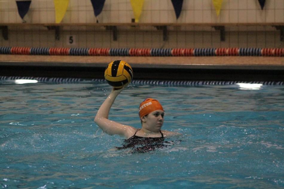 Senior Madelaine Wood launches a throw at practice.