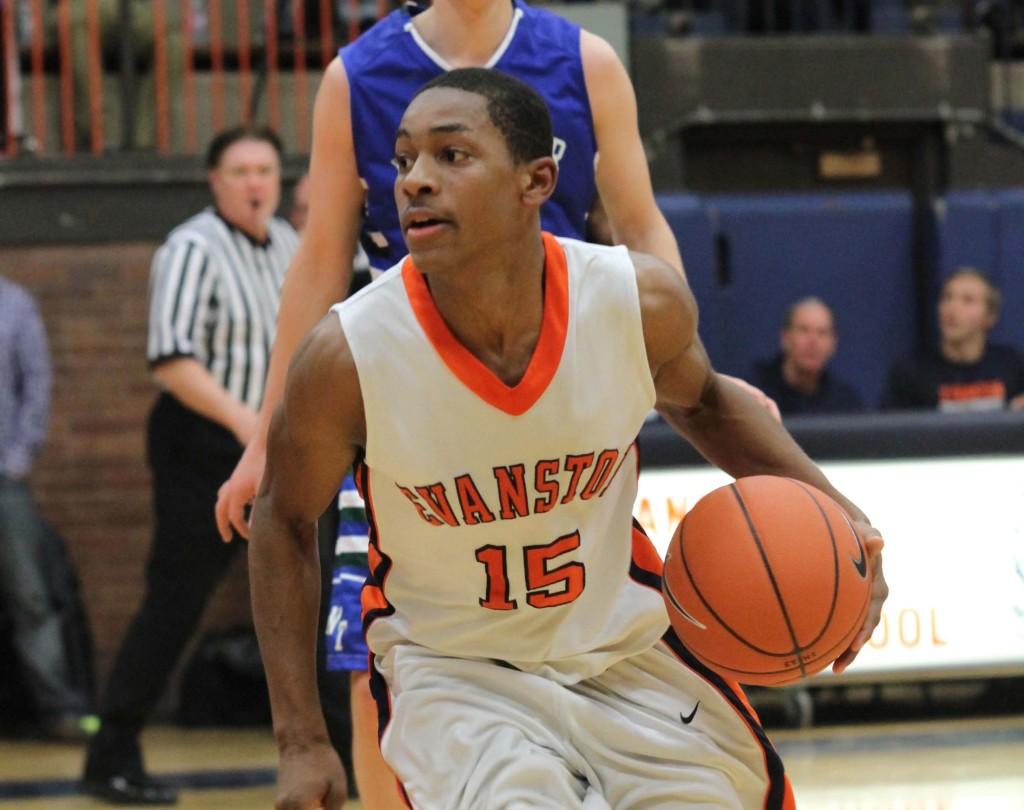 Junior Will Jones dribbles against a New Trier player.