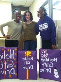 Seniors Micaela Homer, Adrianna and Erika Carter prepare for the gift drive. 