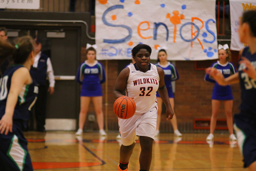 Junior Sade Chuckas dribbles down the court.