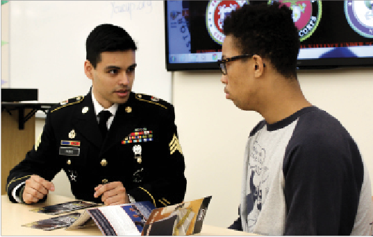 Sgt. Carlos Rubio and junior Jaalen Banner discuss military options.