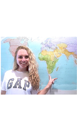 Kiley Leff points to South Africa on a map. 