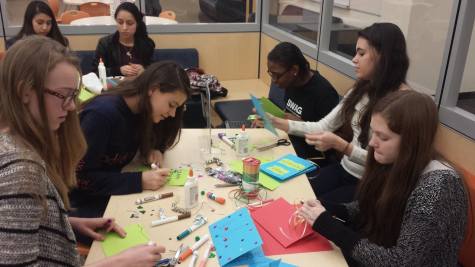 Community Service Club students make holiday cards for hospitalized children.