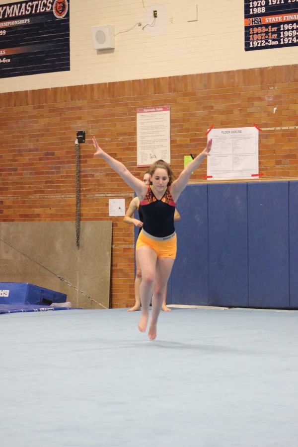 New gymnastics coach put to the test against Maine West