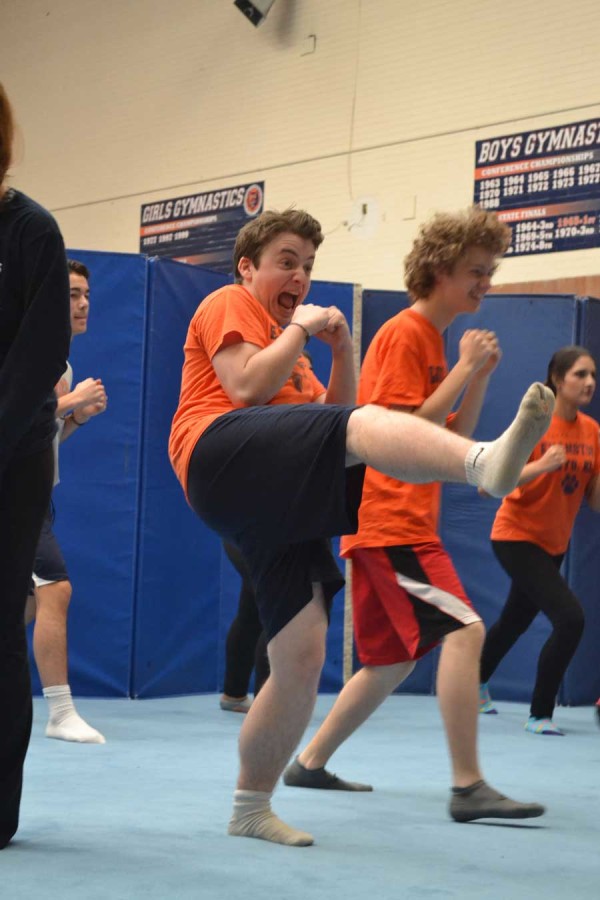 Senior Mo Macsai-Goren and junior Evan Stitely kickbox in Fusion Fitness, one of the classes that will be modified next year.