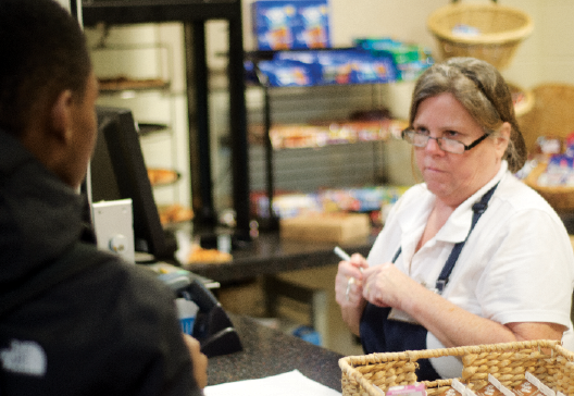 Christine Coulter serves up Afterschool Meals.