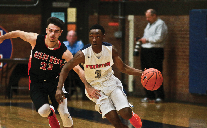 Senior Trevon Marshall drives a Niles West player in the Kits 61-26 win over the Wolves. Photo by Jada Marriott