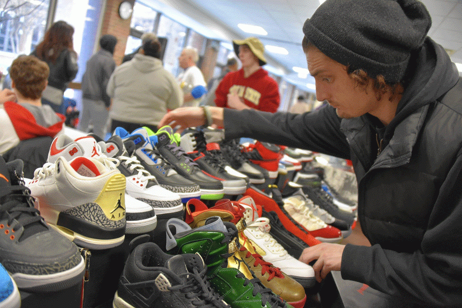 A student looks through the selection at last years Sneaker Exchange. 