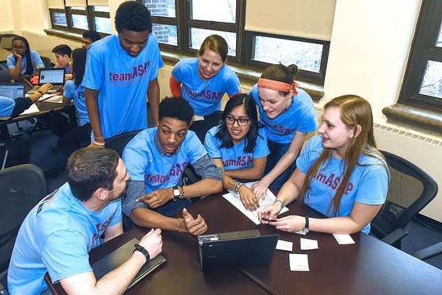 A group of teamASAP members gather to study and problem-solve together.