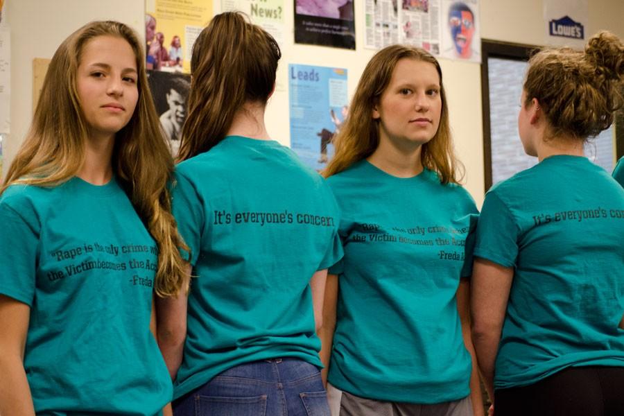 Juniors Grace Giangreco, Catherine Cushing, senior Emily Sommer, and junior Maddie Lee, members of the C.A.R.E. club, wear shirts to promote sexual violence awareness. 