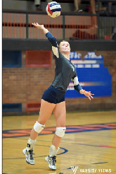 Senior Molly Conover hits a shot against Maine East