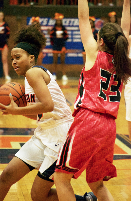 Brianna Miller tries to get around a Maine South defender.