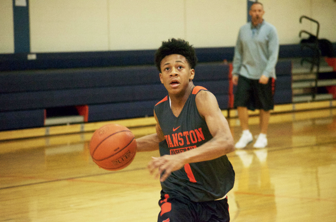 Sophomore Jaheim Holden dribbles up the court