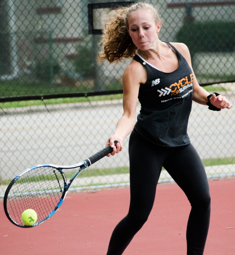 Annie Hedges returns a serve