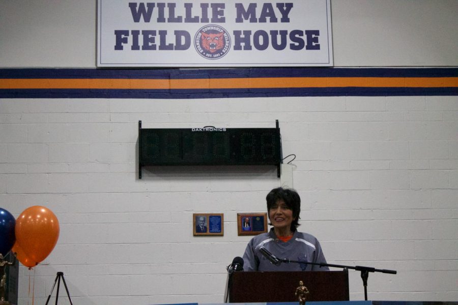 Norma May speaking at the  ceremonial dedication of the Fieldhouse to Willie May.