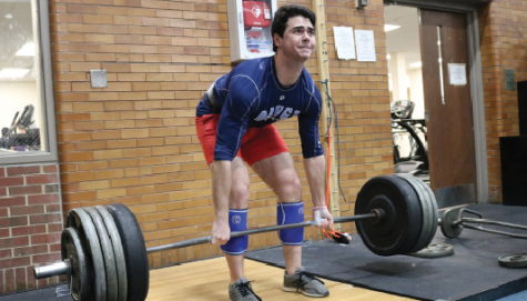 Senior Will Peterson successfully deadlifts 455 pounds during a baseball workout.
