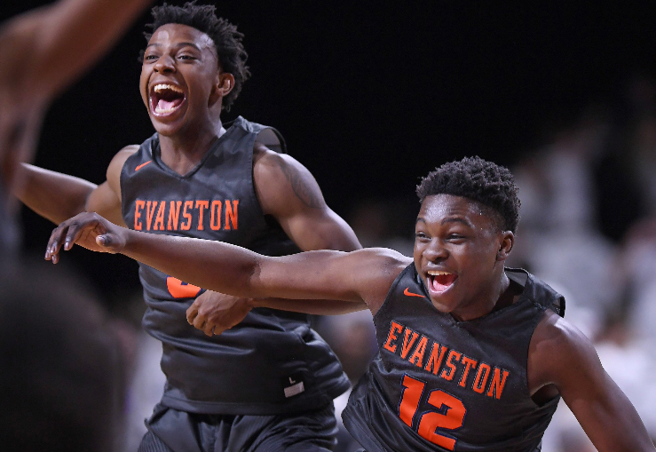 Junior players Lance Jones and Rasheed Bakare celebrate the victory on Tuesday night.