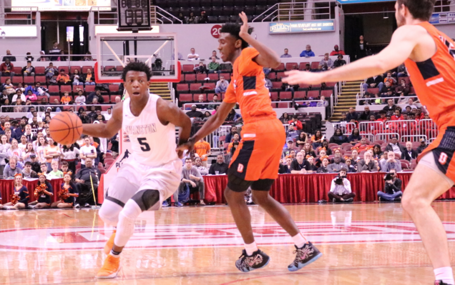 Senior Lance Jones dribbles past defenders at the state semi-final game last spring.