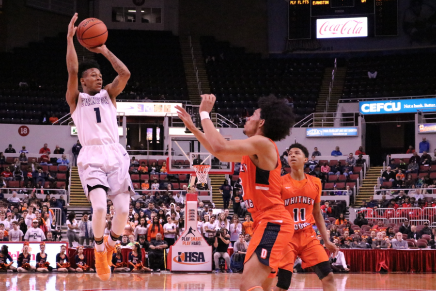 Junior Jaheim Holden takes a jump shot over a defender.