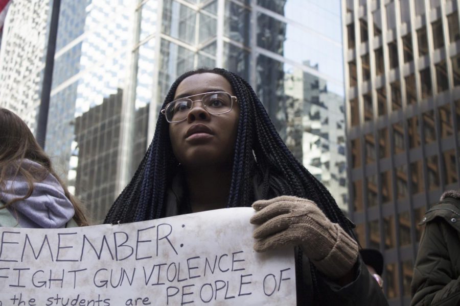 A+Chicago+student+rallies+against+gun+violence+on+behalf+of+people+of+color+at+the+April+20+march.+