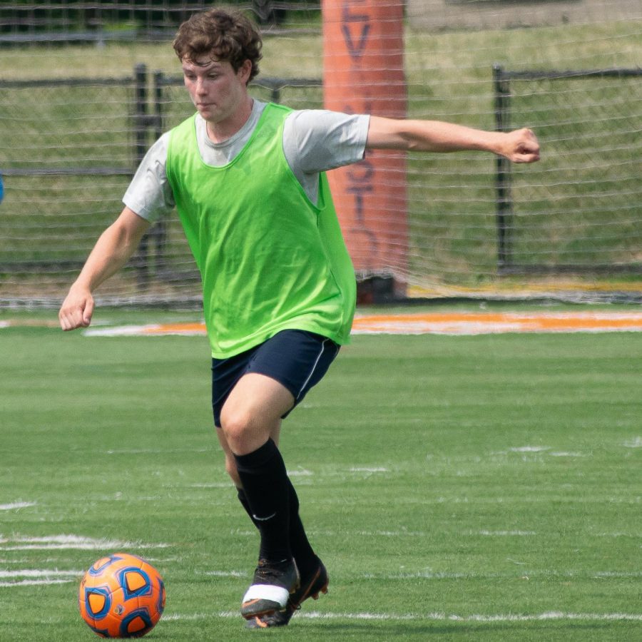 Junior Quinn Ackman shoots on goal at practice.