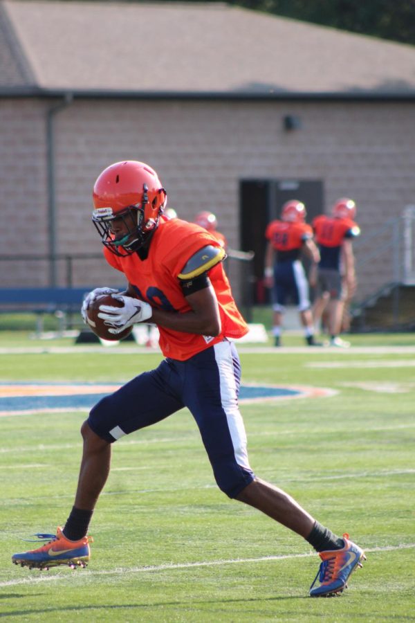 Junior Darrius Hunt catches a pass during summer practices.