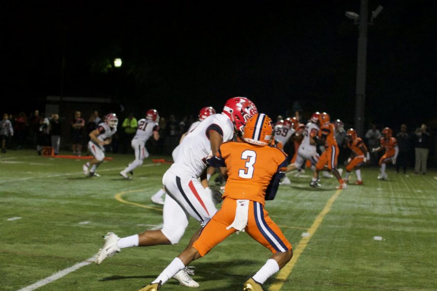 Defensive back Trenton Bertrand covers Hawks wide receiver.