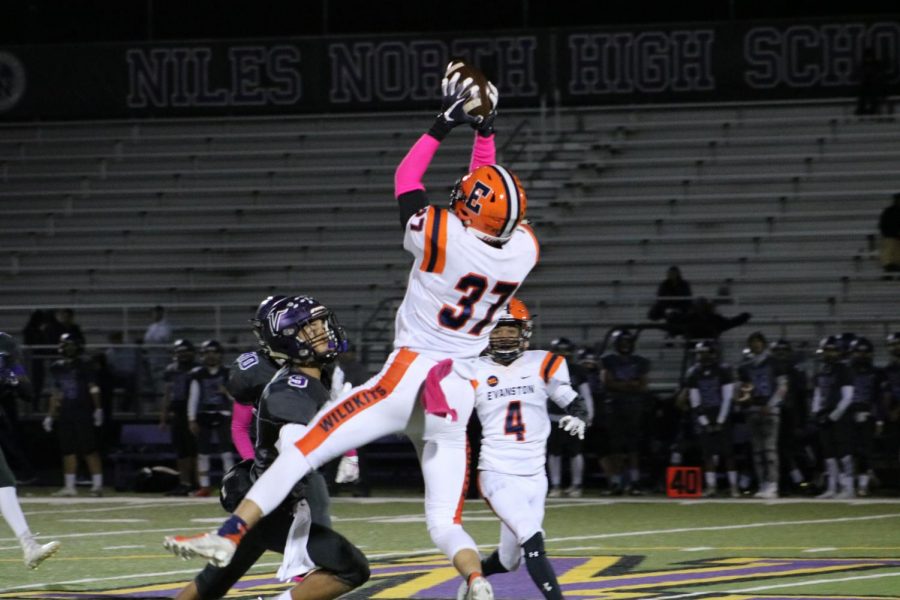 Senior Michael Axelrood elevates for a catch versus Niles North.