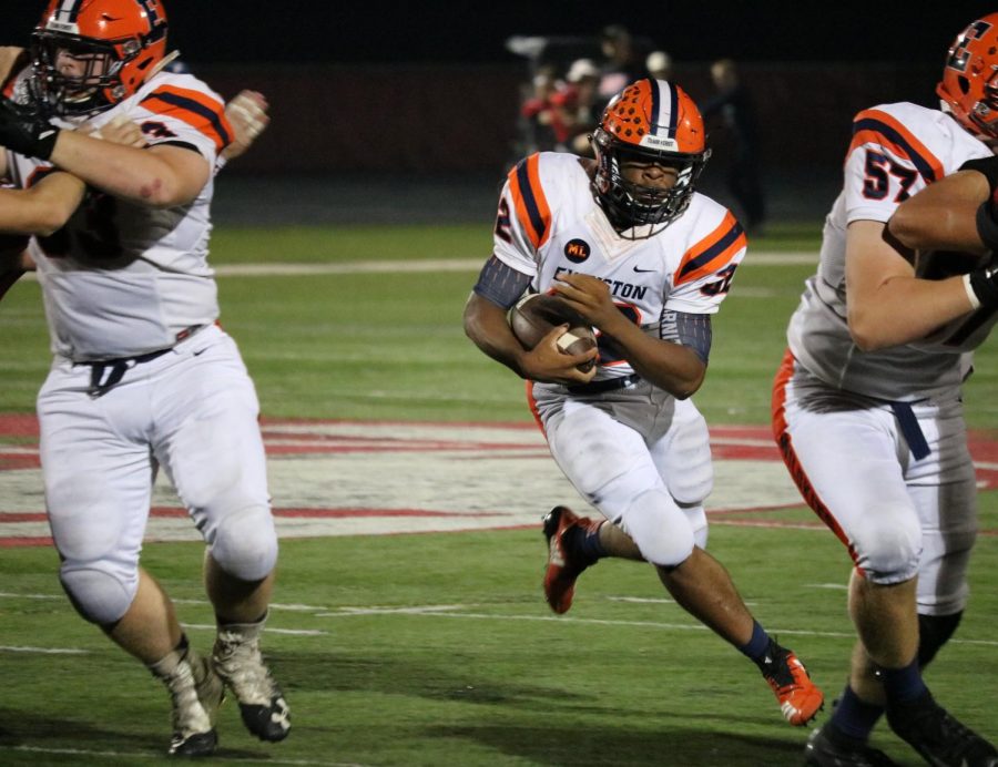 Senior running back Cion Miller-Smith sprints through the Glenbrook South defense.