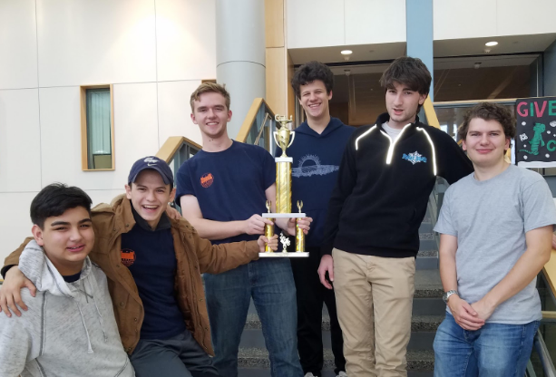 Scholastic Bowl team celebrates recent victory. 