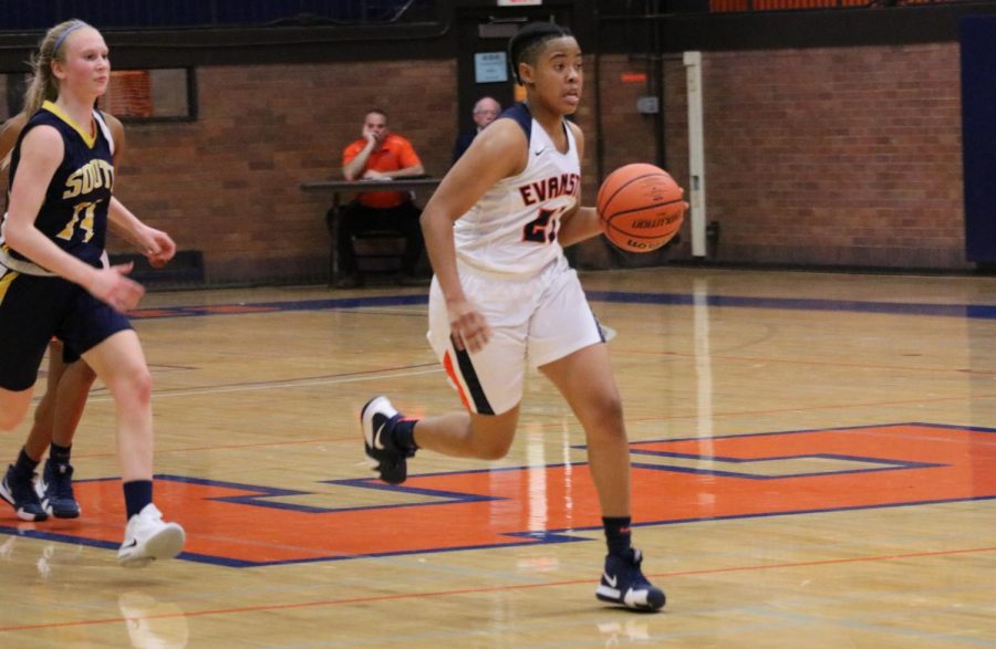 Junior Tyler Mayne dribbles the ball up the court in Wednesdays win against GBS.