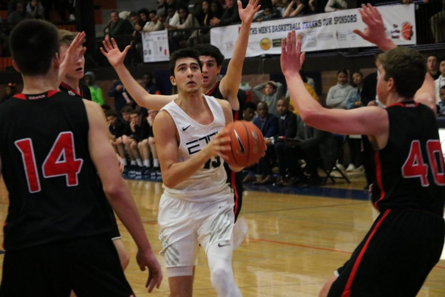 Sophomore Louis Lesmond drives to the hoop.