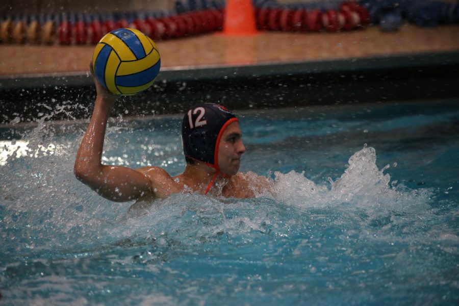 Senior Santi Ramos-Torrescano shoots on goal.