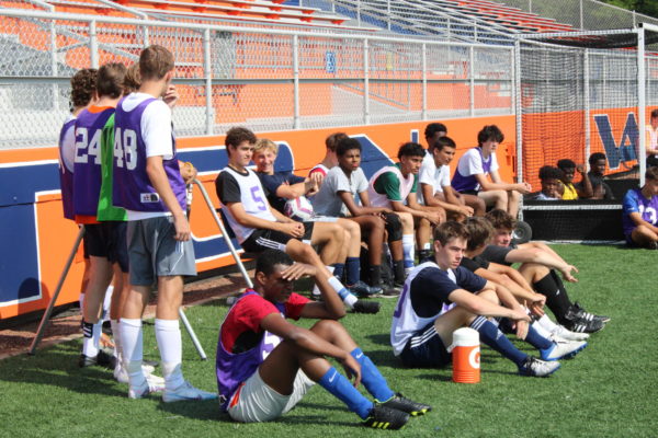 Players resting at tryouts.
