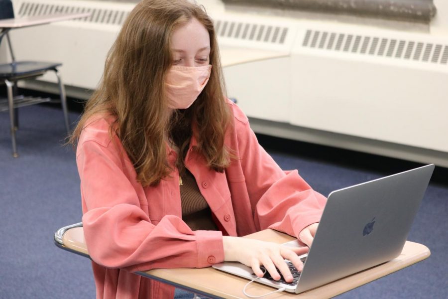 Junior Foster Ellen sits in a hybrid classroom.