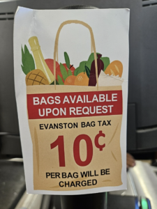 Sign informing customers of the bag tax at Jewel-Osco.