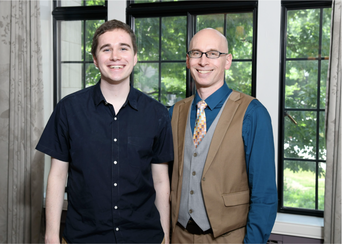 Mr. Van Krey (right) standing with Liam O’Carroll (left) at award luncheon during the Northwestern Commencement weekend.