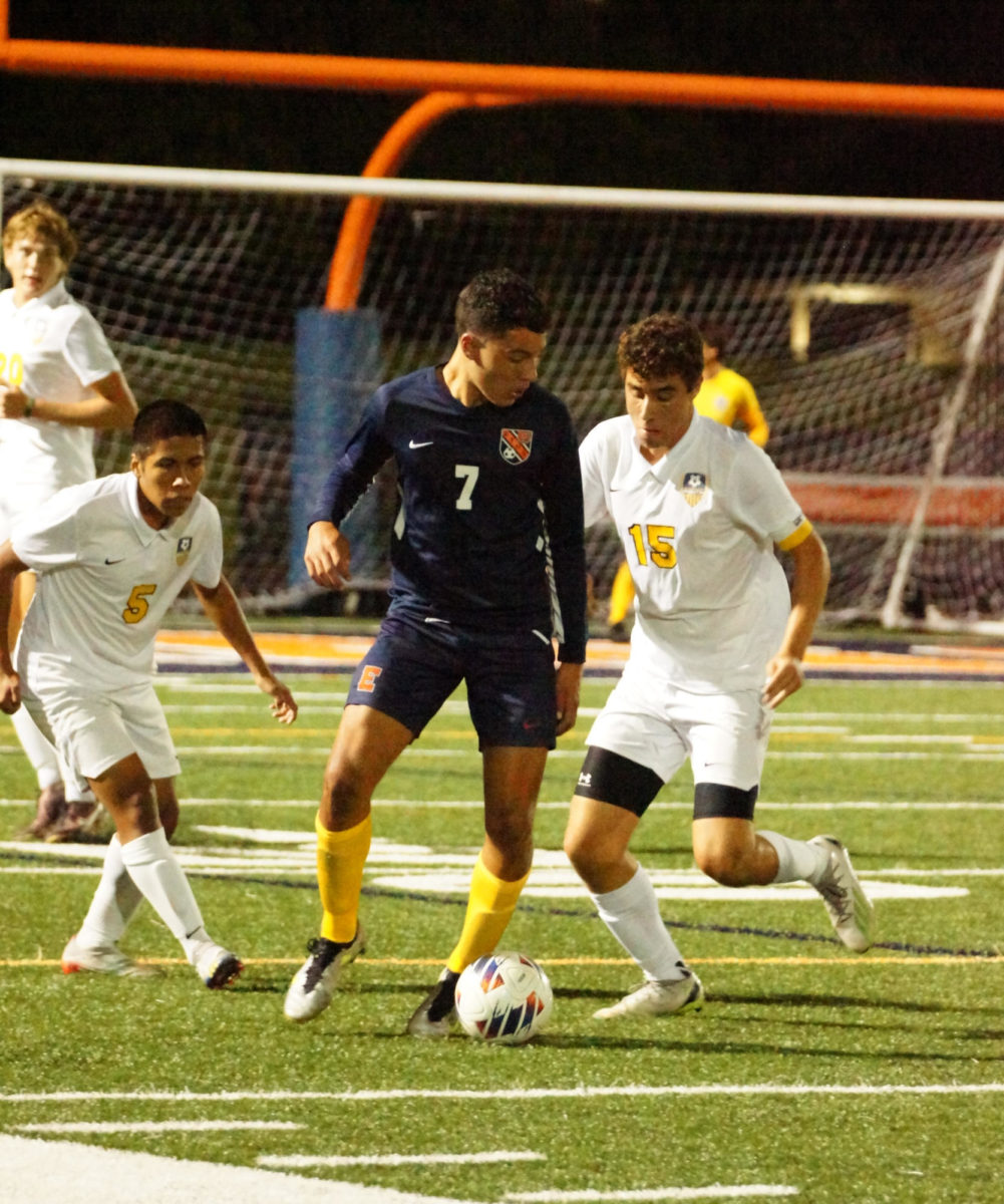 Junior Johnny Hunwick takes on two defenders in Tuesdays night win against Glenbrook South