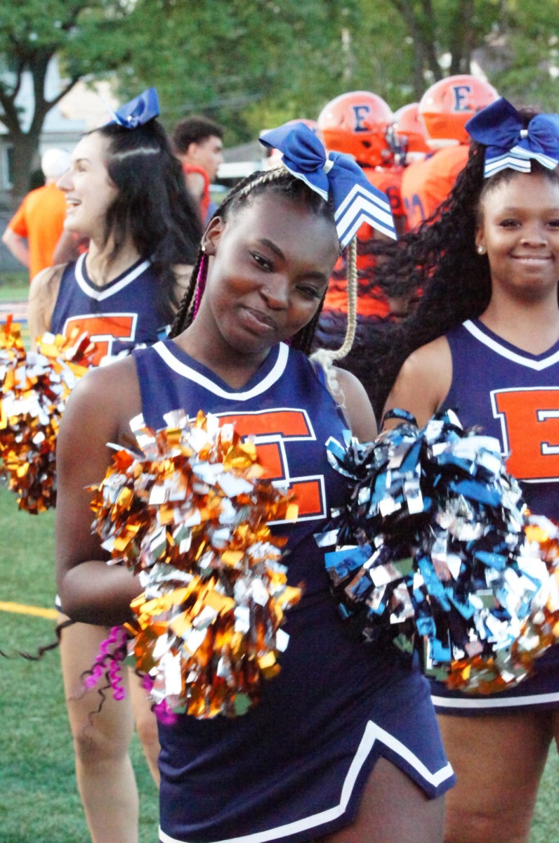 Evanstons cheerleaders perform alongside its pomkits.