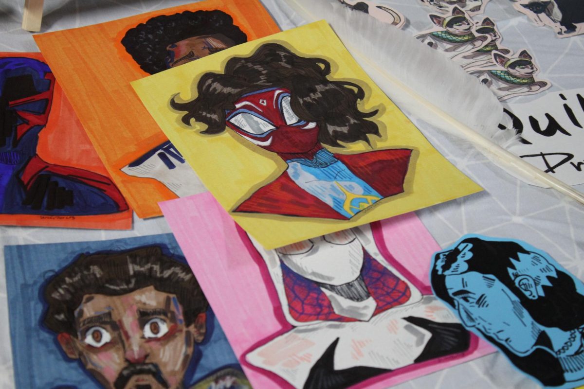 Art on display featuring characters from Spider-Man: Across the Spider-Verse.