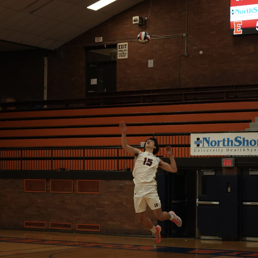 Junior Kaloyan Mirtchev serves in Evanstons win against Maine South.