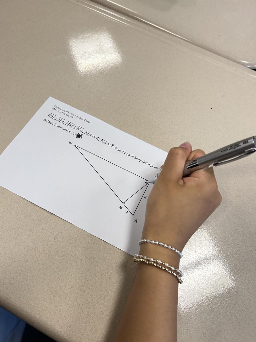 A math team member works on a problem