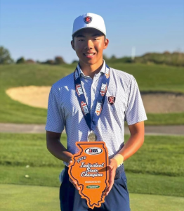 Photo courtesy of ETHS Instagram
Lester Low poses with trophy after winning State.