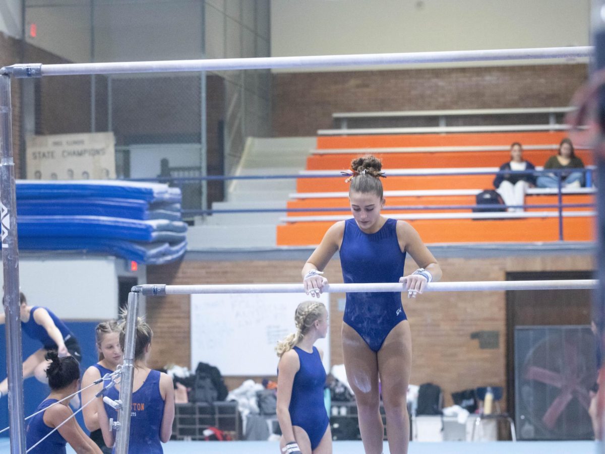 Maddie Brandt gets ready to do her bar routine. Photo by Stuart-Rodgers